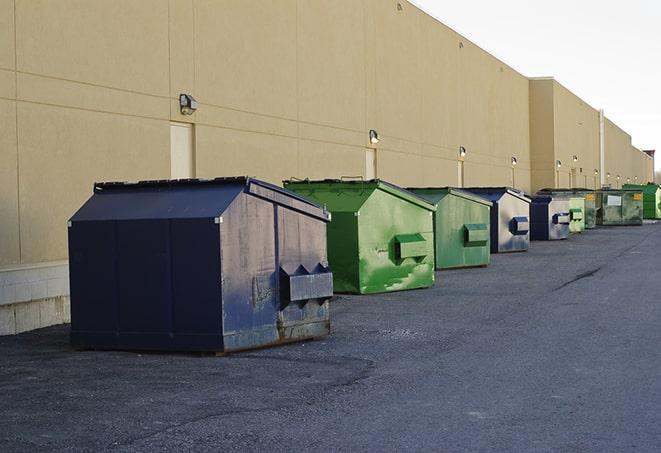 dumpsters with safety cones in a construction area in New Bedford MA